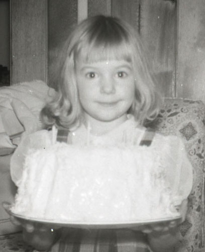 Mom always made fancy birthday cakes.  This is me with my angel food cake.  It's almost as big as I am!